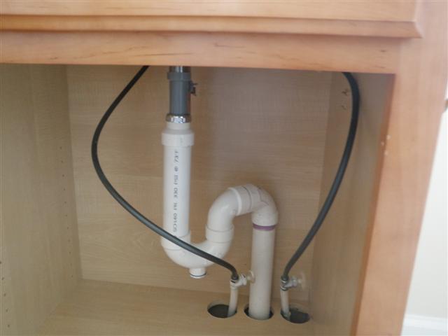 Image of improper plumbing trap installation